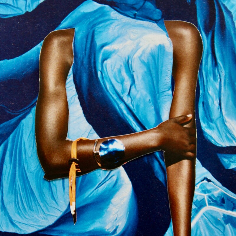Black woman with blue cloth over her head and flowing around her like a river. 