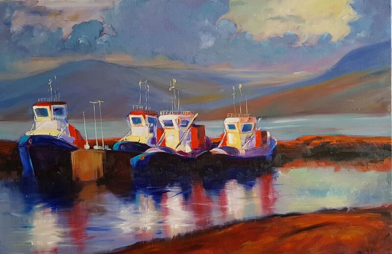 Tugboats moored near a body of water, rolling hills and cloudy sky behind them.