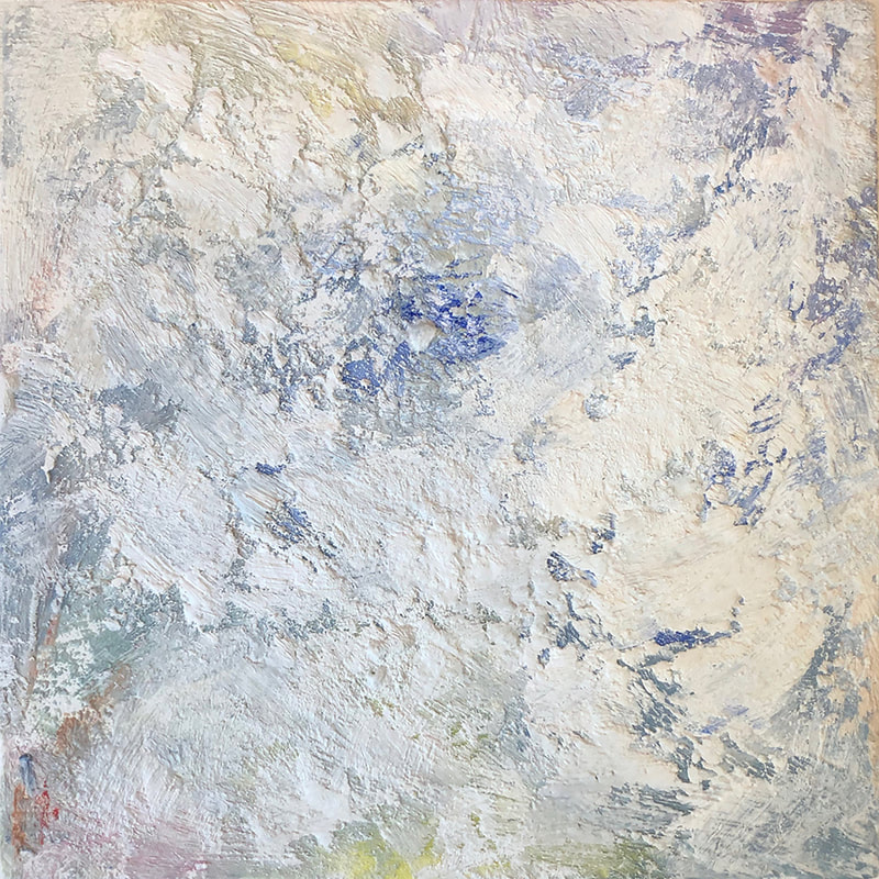 Encaustic art. White with dark blue below and a smudge of red in lower corner. Looks like an aerial shot of the arctic.
