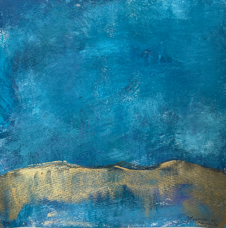 Smudged blue abstract painting with gold hills toward the bottom.