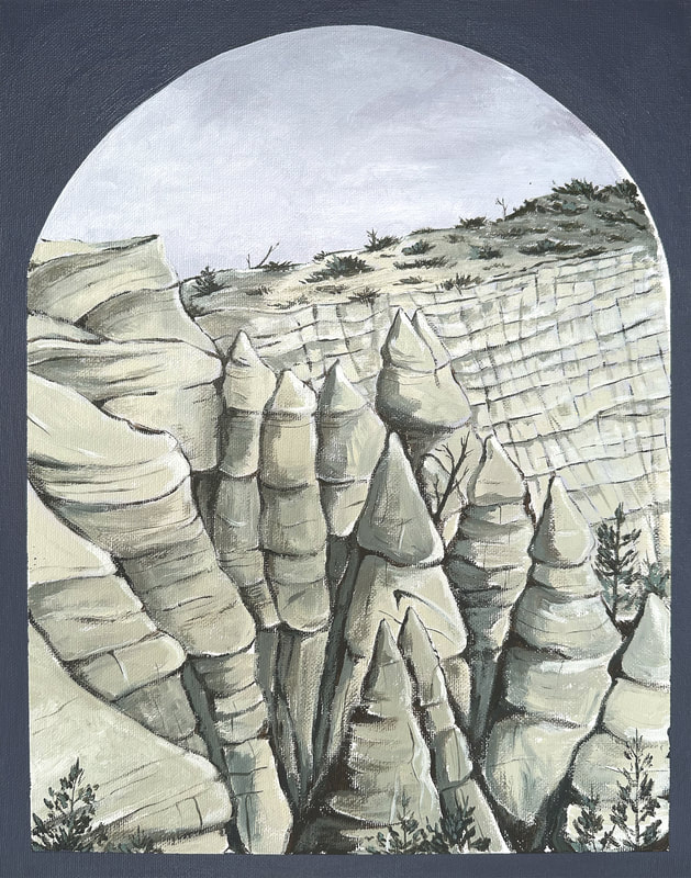
Adjacent to a tall, striated cliff beneath a cloudy sky stand pale, conical rock formations