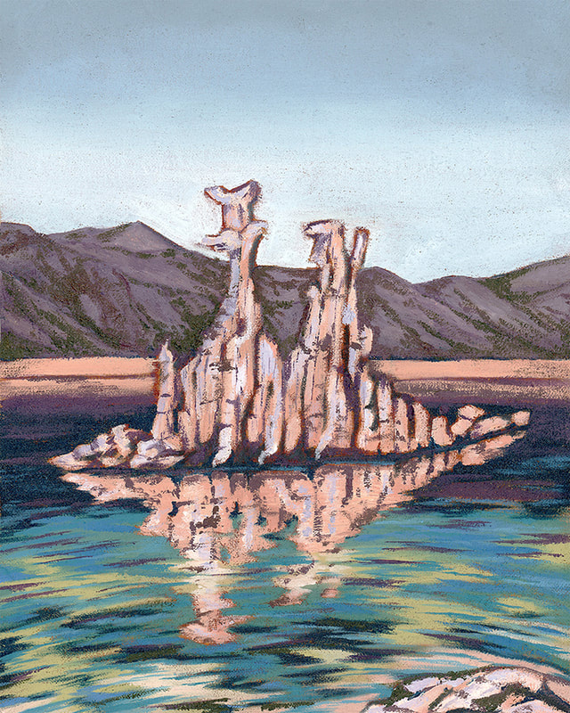 Strangely-shaped rock formations rise from a lake. In the background, a mountain range