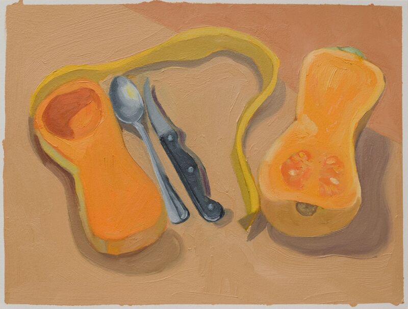 Still life, spaghetti squash cut in half with a long strip of squash skin, knife and fork between the two halves