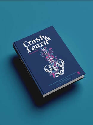 Book cover. Dark blue with a white spine and pink flowers.